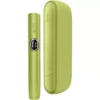 Green heat-not-burn tobacco device with a matching green charging case (IQOS-style) side-by-side, showing a rounded handheld unit and a case.