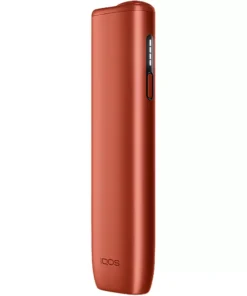 Copper-orange IQOS heated tobacco device shown from the side with a vertical control panel and buttons visible on the right edge