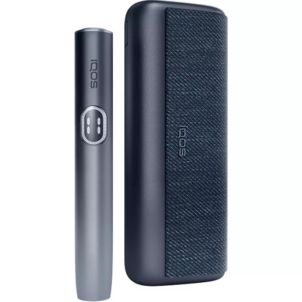 IQOS heated tobacco device standing upright next to a dark textured carrying case.